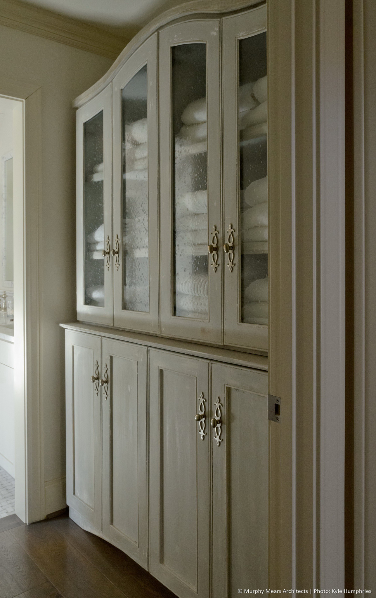 Pemberton Residence - Custom linen cabinet within the vestibule entering the master bath.