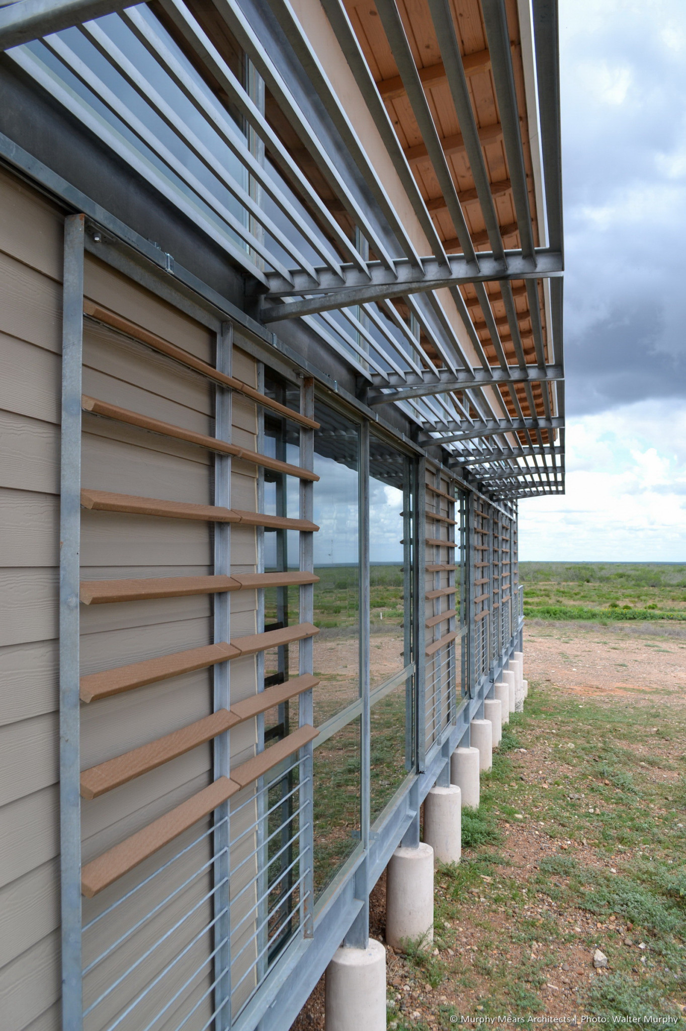 galvanized steel louver awning above rolling shutter with composite wood and steel bars